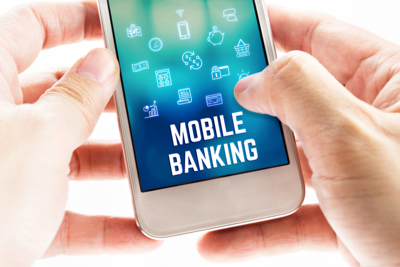 Two hands holding mobile phone with Mobile banking word and icons