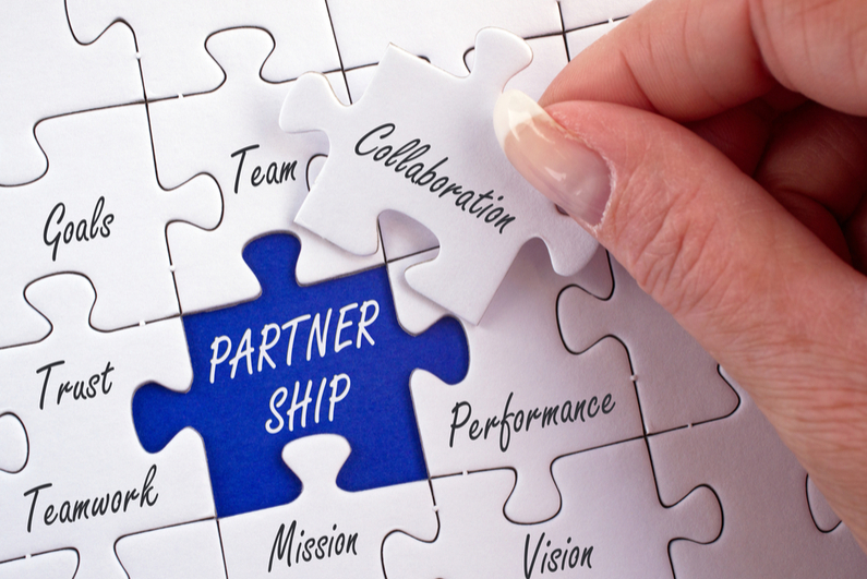 Jigsaw puzzle piece labeled PARTNERSHIP