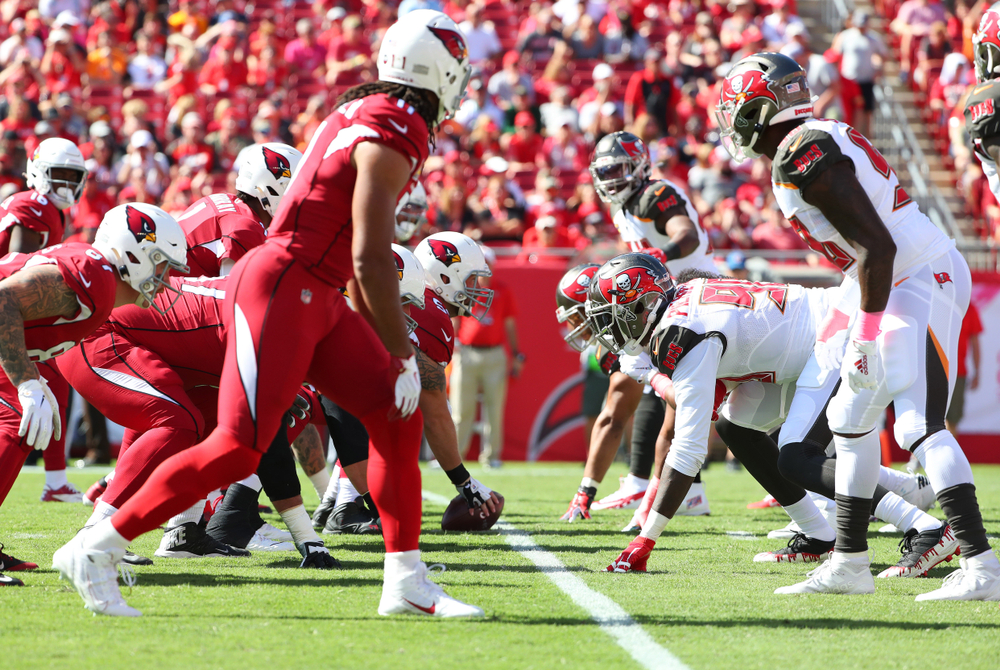 Arizona Cardinals and Tampa Bay Buccaneers lining up pre-snap during a game on November 10, 2019