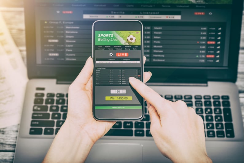 Person betting on soccer on a smartphone