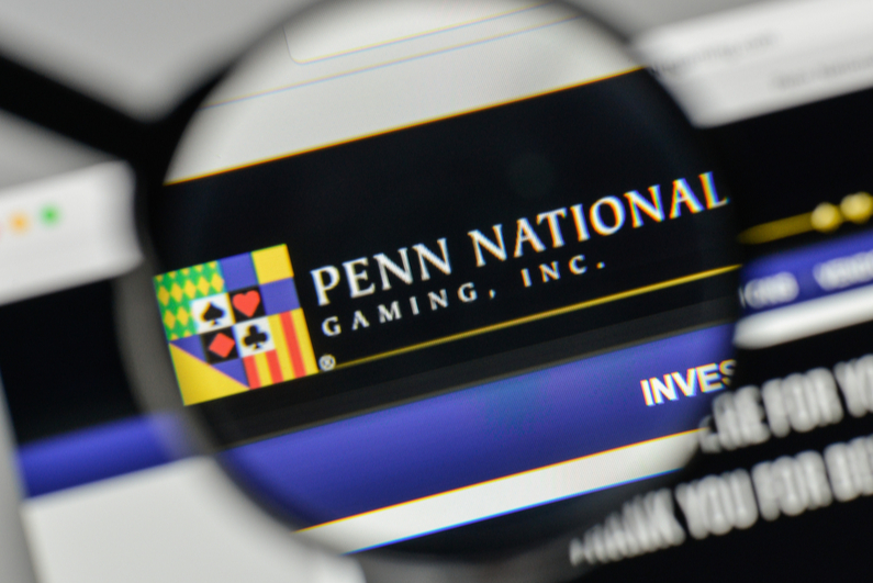 Penn National logo on computer through magnifying glass